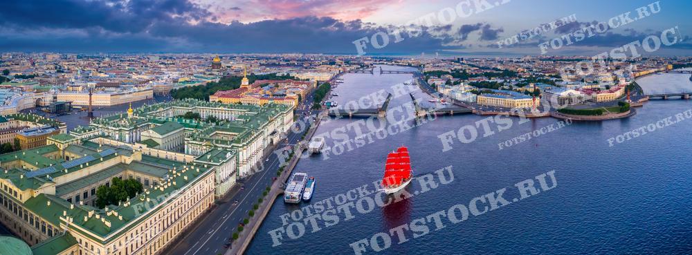 Фотография связана с праздником "Алые Паруса", который является ярким и волнующим событием выпускного вечера в Санкт-Петербурге и известен своим фейерверком и проходящим по реке Неве кораблём с алыми парусами. Освещённые фасады и мосты во время белых ночей создают волшебную атмосферу этого городского праздника, известного далеко за пределами России.
